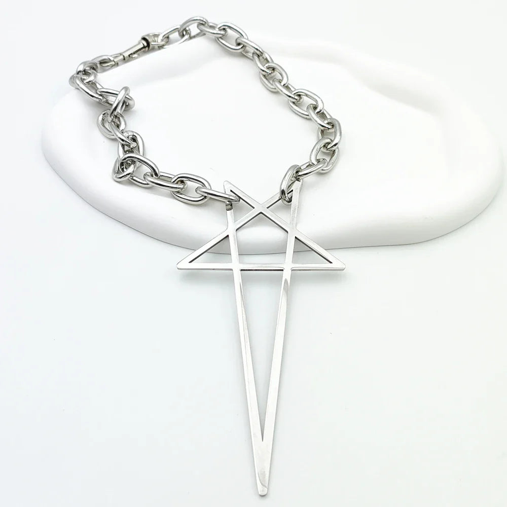 A stainless steel necklace with a thick chain and a large geometric pendant resembling an inverted triangle with a vertical line through it, perfect as bold streetwear jewelry, displayed on a white background.