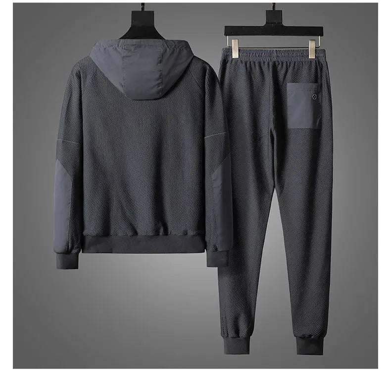 A stylish activewear set featuring a jacket and pants on a swinger, perfect for comfort and mobility.