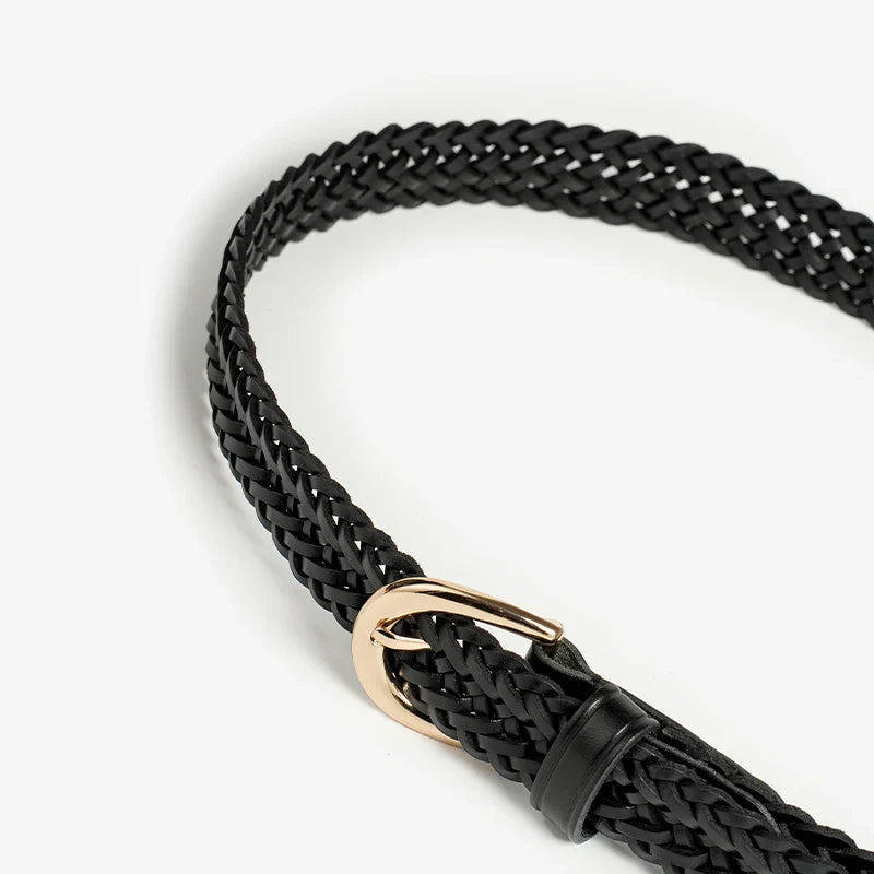 A black woven leather belt featuring artisanal craftsmanship and a shiny gold buckle, displayed on a plain white background.