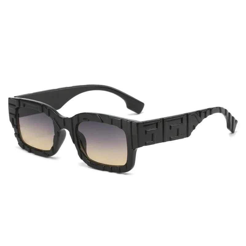 A pair of black, rectangular vintage sunglasses with thick, geometric frames featuring embossed patterns, gradient lenses fading from dark to light, and UV400 protection for superior eye safety.