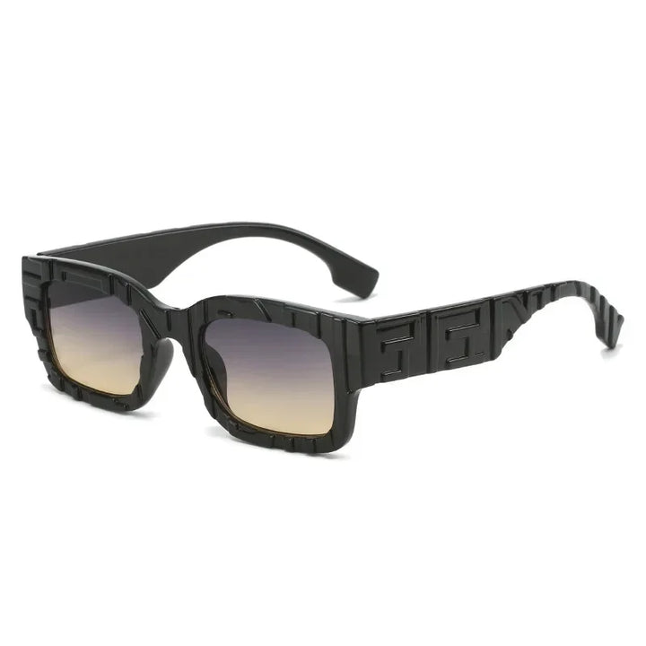 A pair of black, rectangular vintage sunglasses with thick, geometric frames featuring embossed patterns, gradient lenses fading from dark to light, and UV400 protection for superior eye safety.