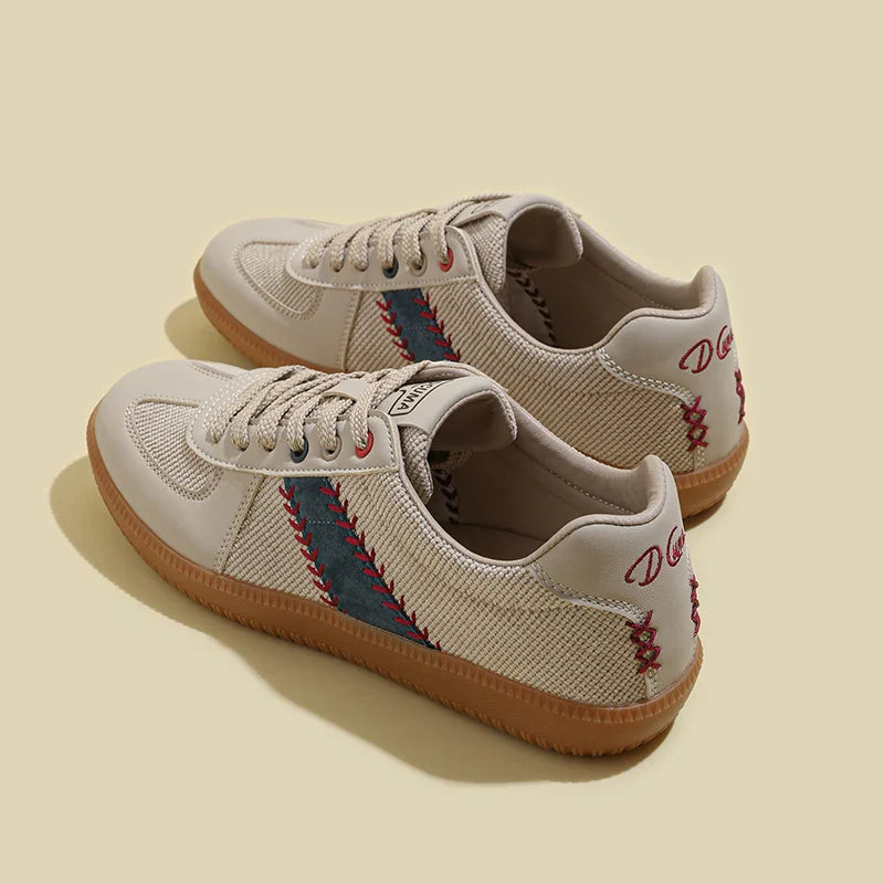 A pair of beige lightweight breathable sneakers with blue and red zigzag stitching on the sides, red D G text on the back, and tan rubber soles featuring EVA midsole cushioning, displayed on a light beige background.