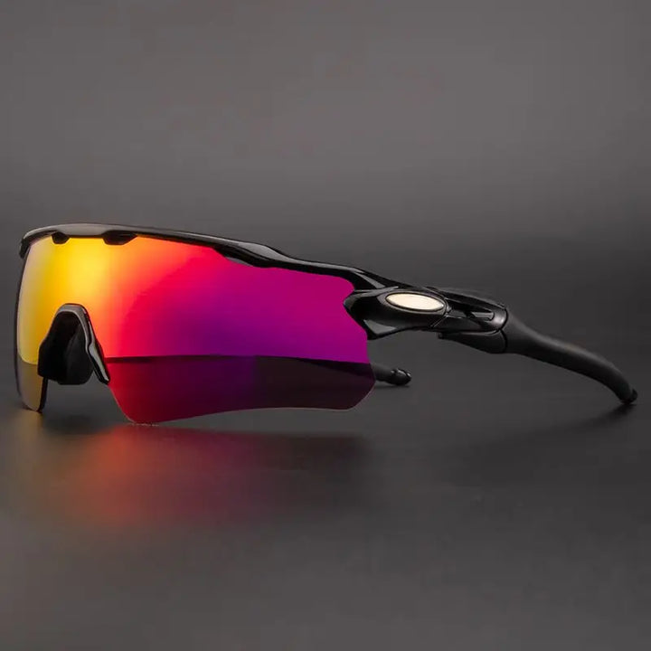 Sport sunglasses with black frames and a single large, mirrored lens tinted in red, orange, and purple offer UV protection, displayed on a dark gray background.