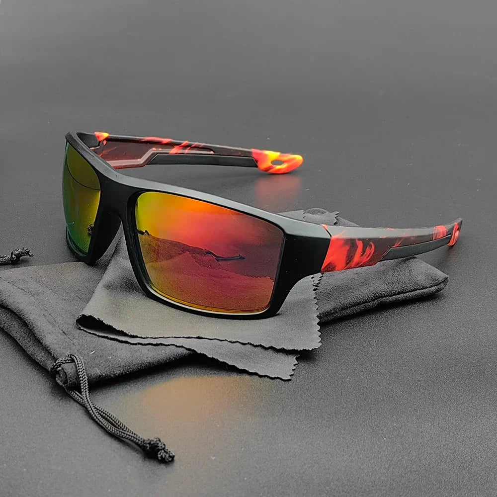 A pair of Everest Sunglasses with red and black marbled frames and yellow-orange mirrored polarized lenses, offering UV protection, rests on a black drawstring pouch and cleaning cloth on a dark surface.