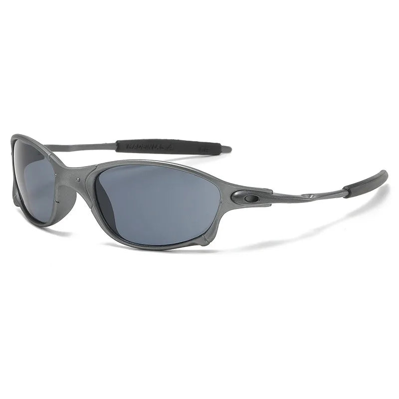 A pair of sleek, dark gray cycling sunglasses with oval-shaped lenses, a lightweight curved frame, and UV400 protection for ultimate eye safety.