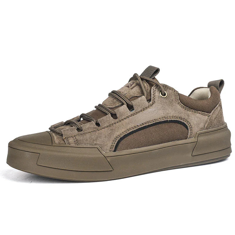A brown casual sneaker with suede and mesh panels, brown laces, and a thick durable rubber outsole, shown from a side angle on a white background.