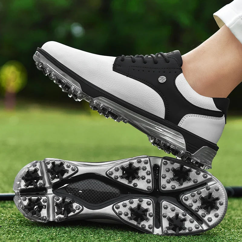 A pair of genuine leather golf shoes with spiked soles; one shoe is worn and raised to display advanced grip technology, while the other lies flat on green grass, golf clubs blurred in the background.
