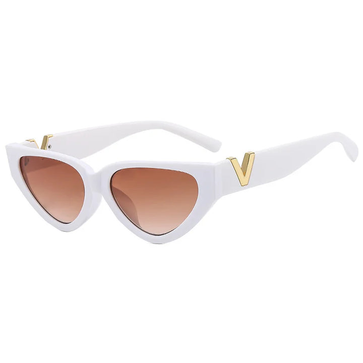 White vintage cat eye sunglasses with a bold frame, brown gradient lenses, UV400 protection, and gold V accents on the temples, set against a white background.