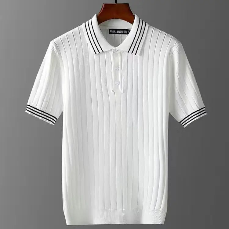 A premium polo shirt featuring a white short-sleeve knit design with vertical ribbed texture, black double stripes on the collar and cuffs, and subtle corduroy detailing, displayed on a wooden hanger against a gray background.