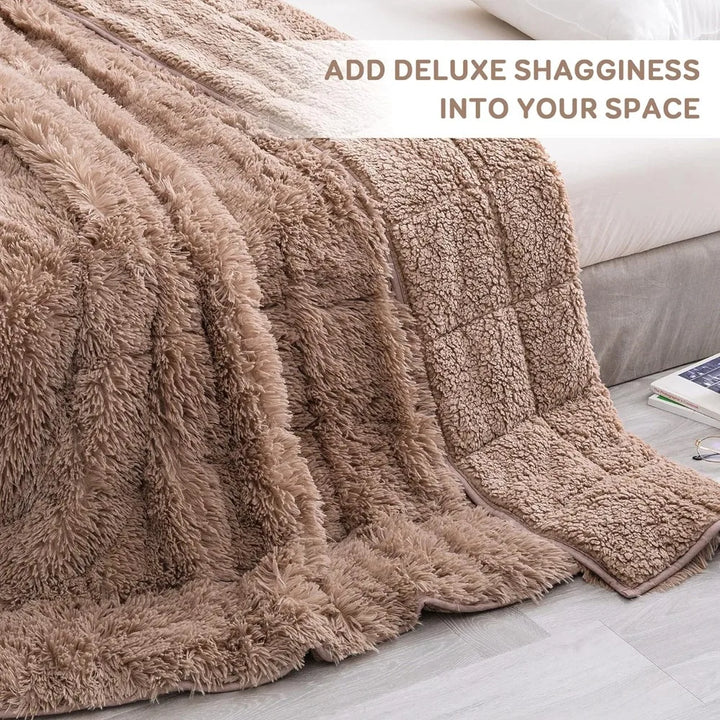 A fluffy, brown Shaggy Long Fur Weighted Blanket draped over the edge of a bed, with the text ADD DELUXE SHAGGINESS INTO YOUR SPACE in the top right corner. Part of a light-colored floor and nightstand are visible.