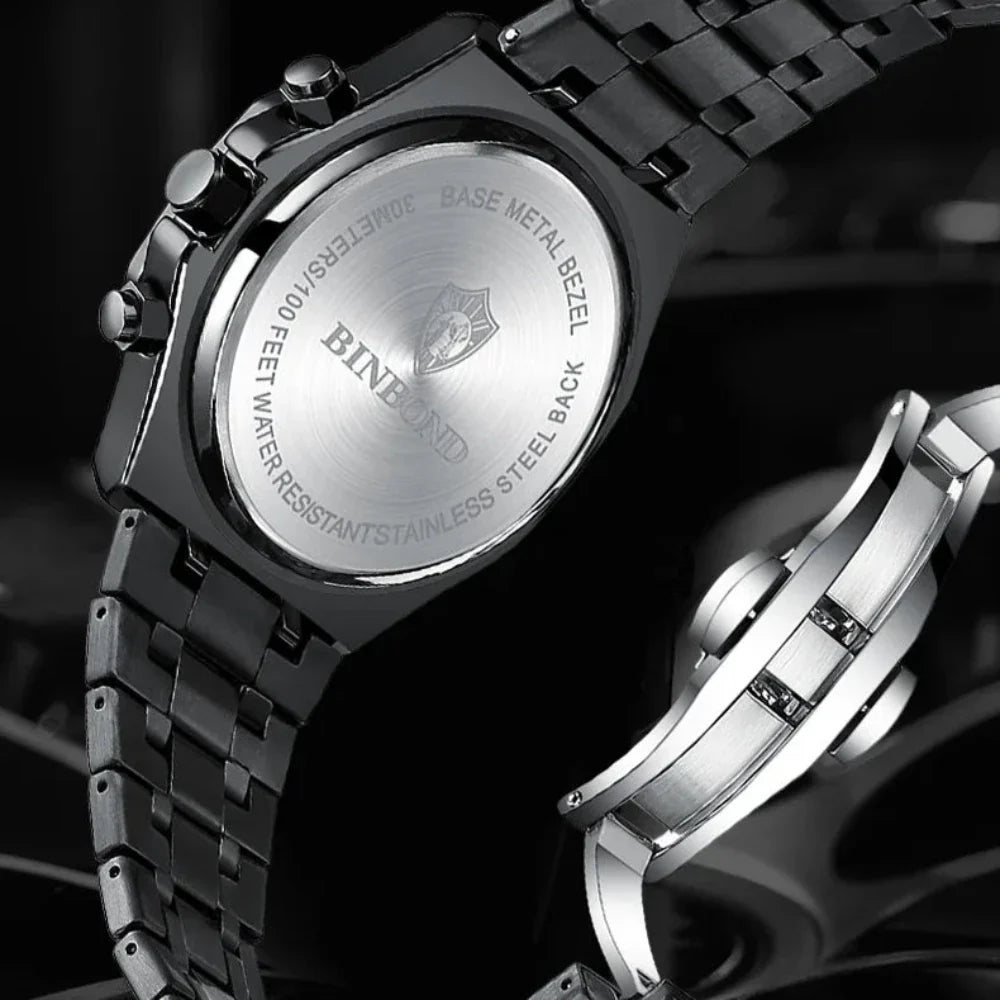 Close-up of the back of a stainless steel watch by BINBOND, featuring engraved water resistance details and a metal link bracelet. The clasp is also visible beside the watch, showcasing its precision quartz movement.