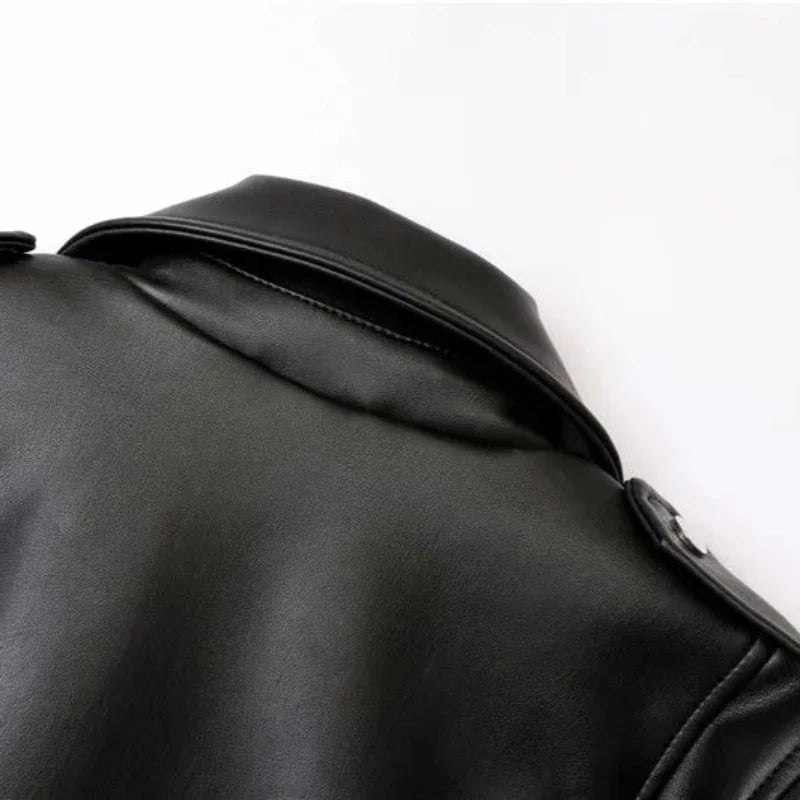 Close-up of the upper back and collar of a black leather jacket with an adjustable waist belt, set against a plain white background. The material appears smooth and slightly shiny.