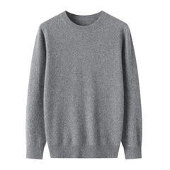 A plain, long-sleeved, light gray crewneck sweater made of soft knit fabric and showcasing fine wool craftsmanship, displayed on a white background.