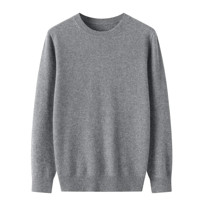 A plain, long-sleeved, light gray crewneck sweater made of soft knit fabric and showcasing fine wool craftsmanship, displayed on a white background.