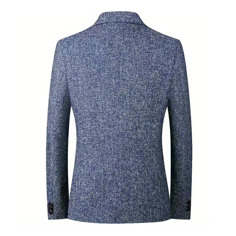 Back view of a textured blue blazer with long sleeves, a notched collar, and button details on the cuffs. The tapered fit and breathable material offer timeless style, displayed against a white background.
