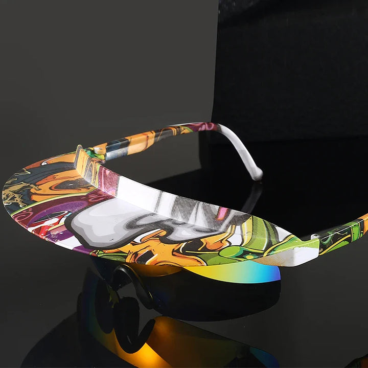Colorful, futuristic sunglasses with a single, wide, visor-style lens featuring an abstract, multicolored pattern and UV400 protection, displayed on a reflective black surface against a dark background.