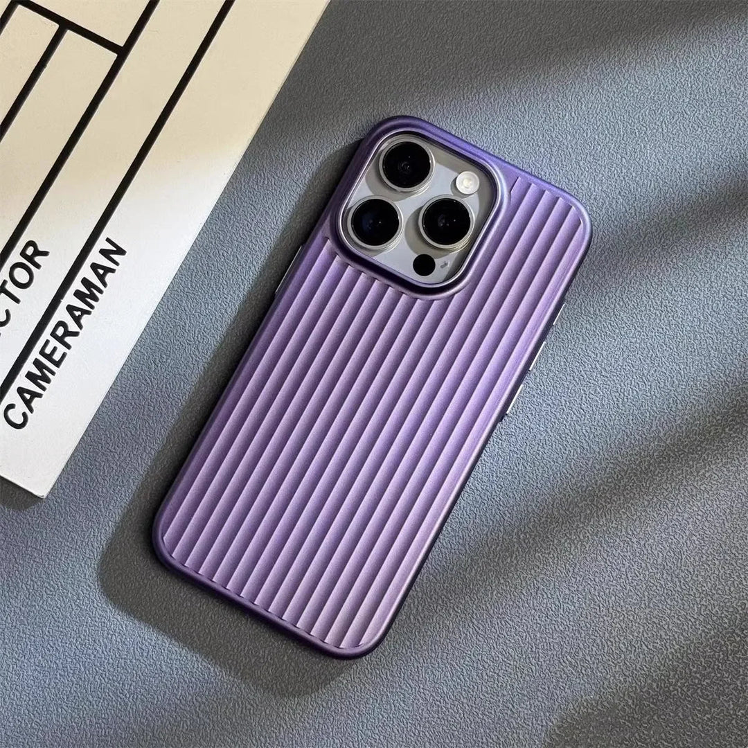 A smartphone with a slim lightweight design and a purple, vertically-ridged case is placed on a gray textured surface next to a sheet of paper labeled CAMERAMAN.