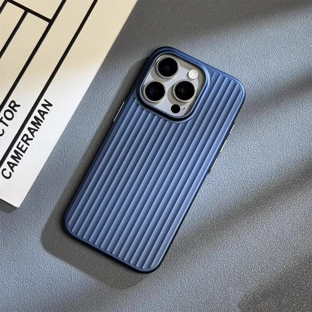 A smartphone with a blue, vertically ridged titanium phone case lies on a textured gray surface next to a white paper labeled CAMERAMAN. The phone has three rear cameras.