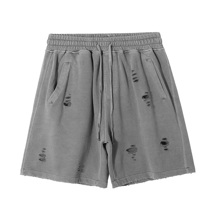 Gray drawstring vintage baggy shorts with an elastic waistband, side pockets, and a cut-up design on the front. The distressed look gives these shorts a casual, worn-in style.