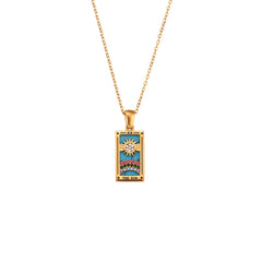 The Solaris Pendant Necklace features a rectangular 18K gold-plated chain with a colorful, tarot-inspired design. The pendant, accented with blue enamel, depicts a sun above a landscape and bears the words The Sun at the bottom.