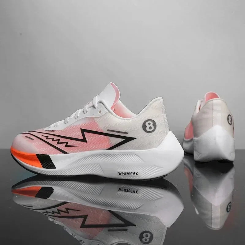 A pair of white running shoes with pink and black accents, zigzag design on the side, and number 8 on the heel. Featuring lightweight construction, one shoe faces forward while the other shows the back. Both sit on a reflective surface.