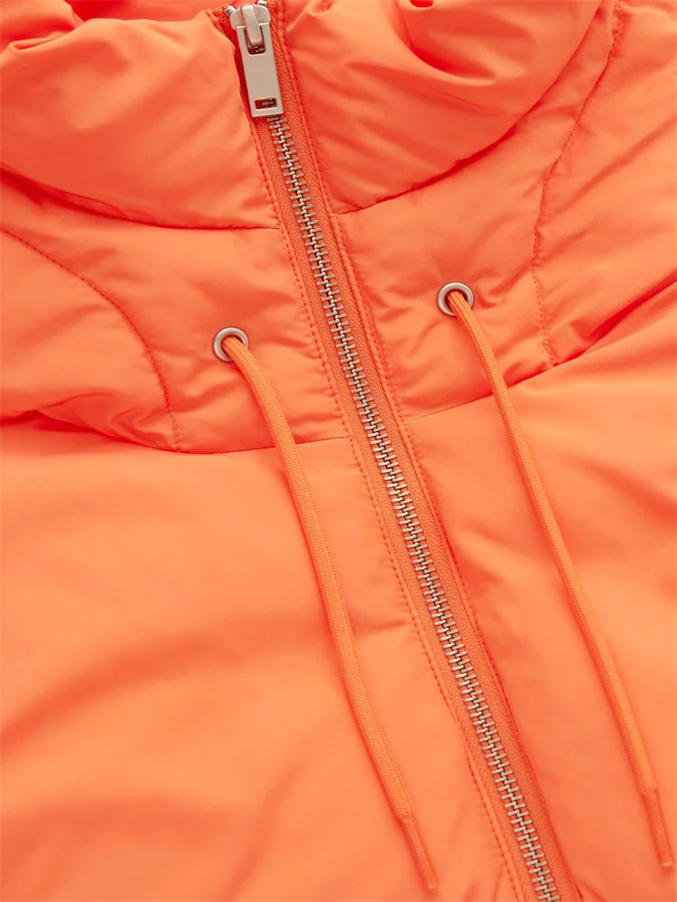 Close-up of an orange puffer jacket featuring a silver zipper and two drawstrings on either side, crafted from durable material with visible stitching and a high, padded collar.