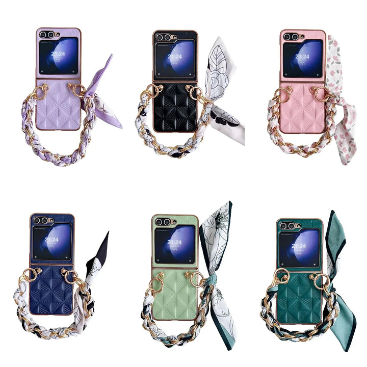 Six Samsung Galaxy Z Flip phones in pastel premium leather cases with gold chain handles and patterned scarves; cases in purple, black, pink, blue, green, and teal. Each case offers shockproof protection. Displayed two rows of three on a white background.