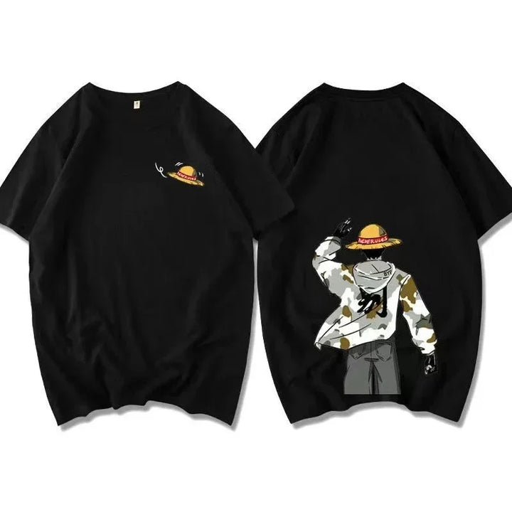 Black cotton knit crew neck T-shirt featuring a small straw hat graphic art on the front left chest and a large cartoon figure in a camo jacket and gray pants on the back, raising one hand in salute.