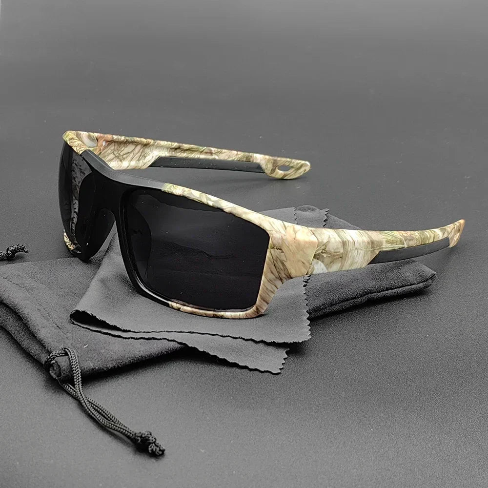 Everest Sunglasses with camouflage-patterned frames and polarized lenses rest on a black drawstring pouch and cleaning cloth, set against a plain gray background, offering ultimate UV protection with bold outdoor style.