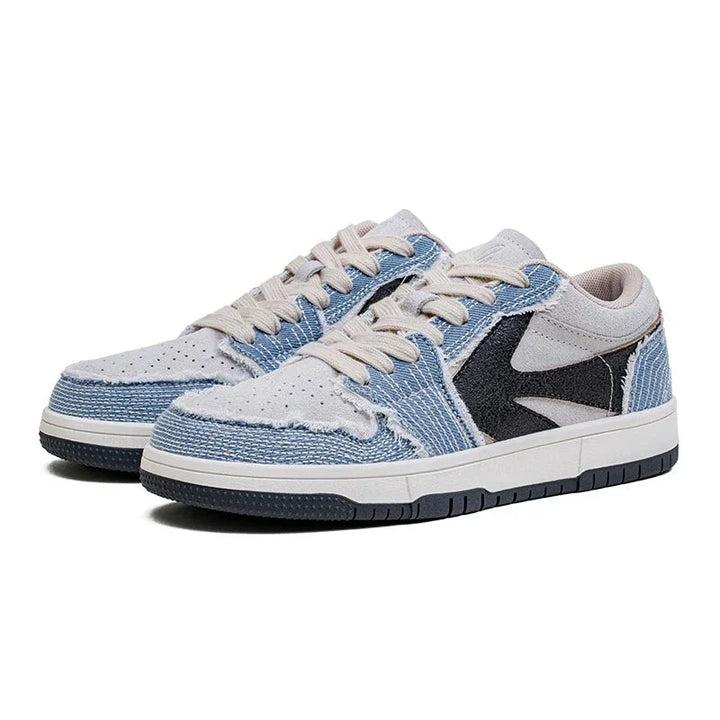 A pair of Denimwave 1986 Pro Sneakers with light blue denim and white uppers, cream-colored laces, a black side accent, and white midsoles with black outsoles for an authentic 80s aesthetic. EVA midsole cushioning provides all-day comfort.