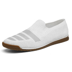 A white men’s casual loafer with a textured knit upper, subtle horizontal stripes, and a brown rubber sole. The breathable shoe features a canvas lining, low profile, and no visible laces for effortless style.