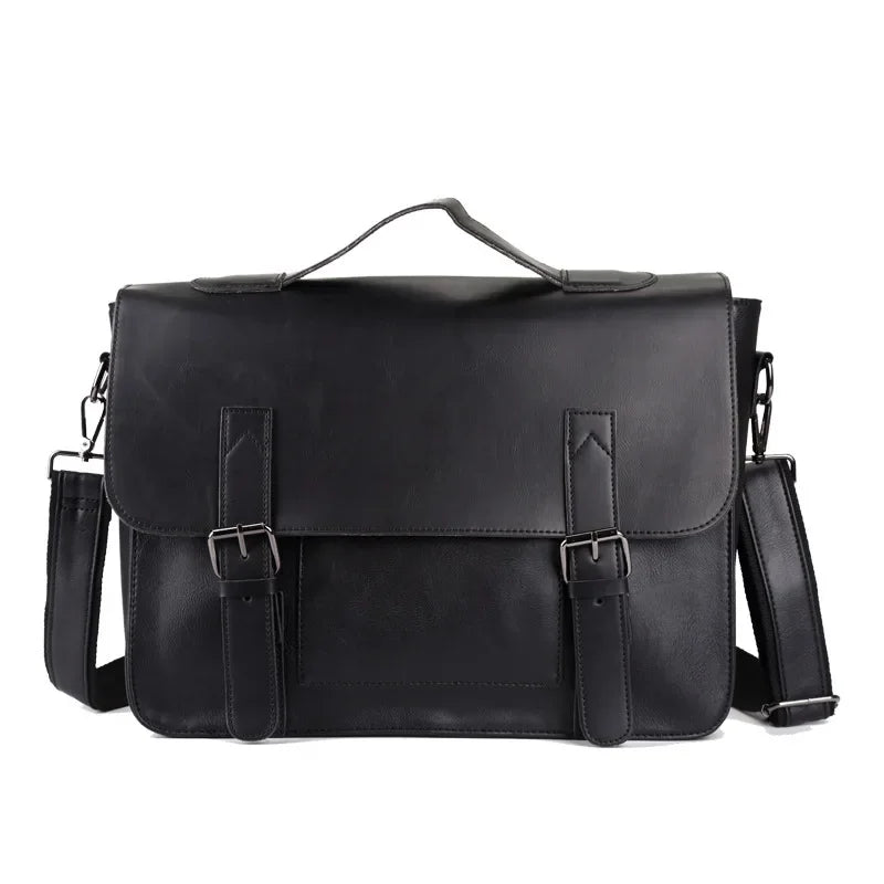 A black messenger bag crafted from premium leather features a top handle, two front buckles, and an adjustable shoulder strap. Its classic, structured design is complemented by a spacious interior for all your essentials.