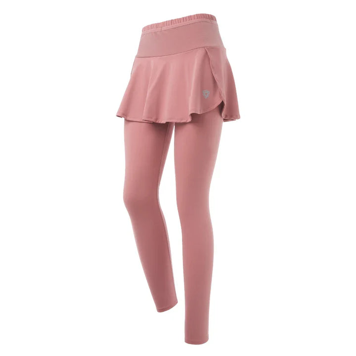 Pink skirted leggings with high-waisted support, featuring an attached flared skirt that covers the upper leggings for a layered, stylish look. Displayed on a white background.