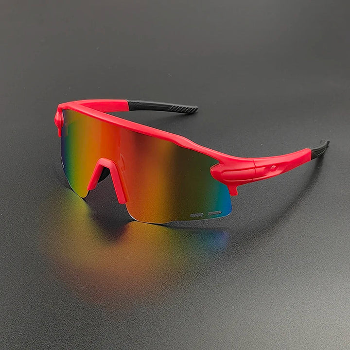 Red sports sunglasses with a wraparound design and mirrored, rainbow-tinted lenses offer UV400 protection, stylishly displayed on a dark, matte surface.