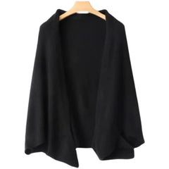 A black open-front cardigan with a loose, draped fit and long sleeves, perfect for autumn winter layering, hangs on a wooden hanger against a white background.