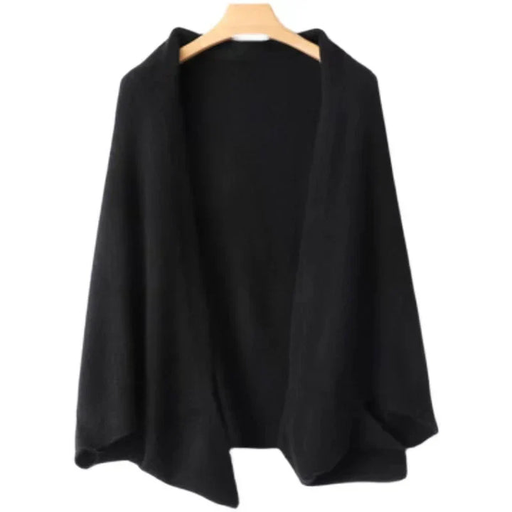 A black open-front cardigan with a loose, draped fit and long sleeves, perfect for autumn winter layering, hangs on a wooden hanger against a white background.