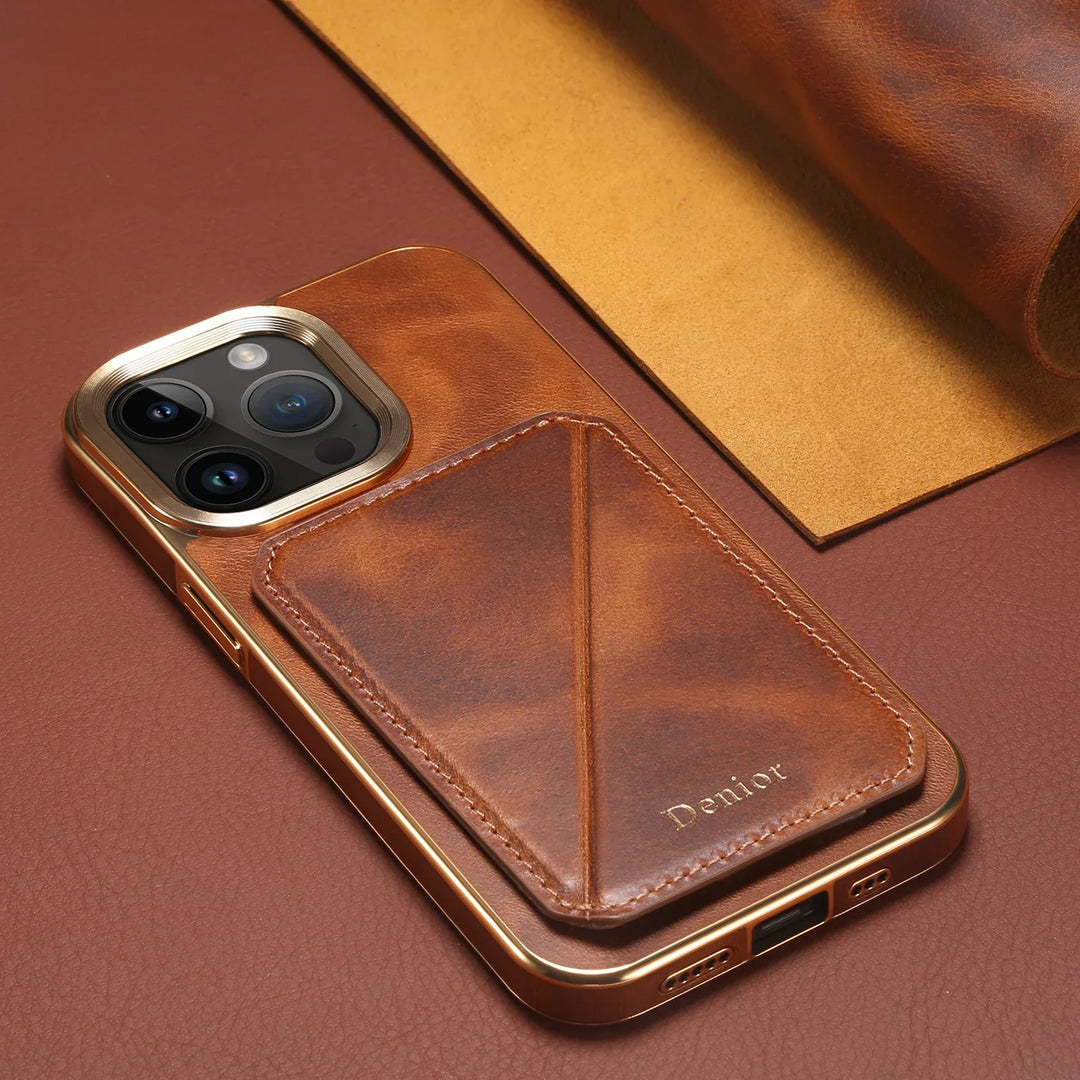 A smartphone with a brown cowhide leather case featuring a card holder and gold accents lies on a matching brown and tan leather surface. The word Deriior is embossed on the card holder section of the case.