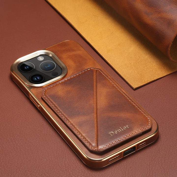 A smartphone with a brown cowhide leather case featuring a card holder and gold accents lies on a matching brown and tan leather surface. The word Deriior is embossed on the card holder section of the case.