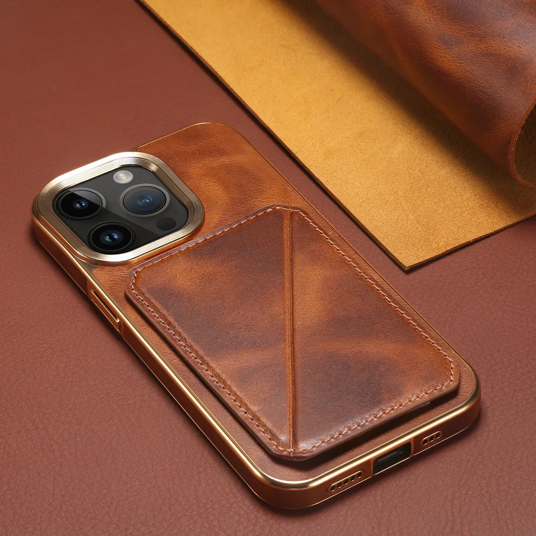 A smartphone with a brown leather iPhone case featuring a built-in card holder rests on a matching cowhide surface, beside a rolled-up piece of leather.