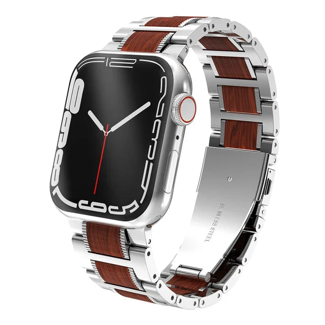 A silver smartwatch with a large, black screen displaying white digital numbers and a red accent on the crown, featuring an adjustable stainless steel watch band with brown wood inlays.