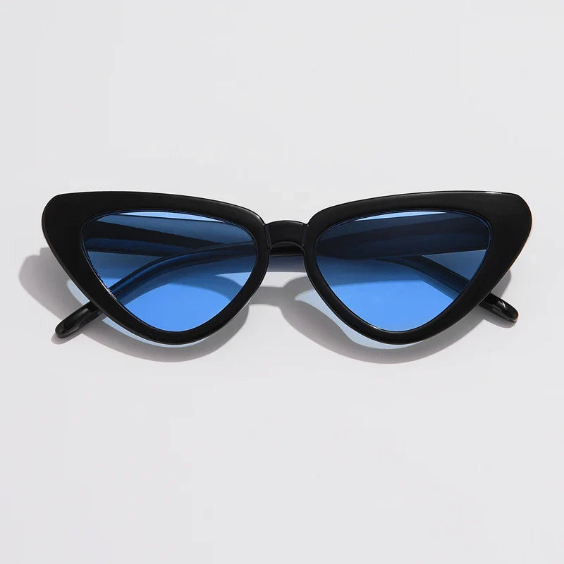A pair of black cat-eye sunglasses with thick frames and blue-tinted lenses, offering UV400 sun protection, is displayed against a plain white background.