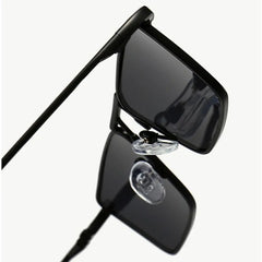 A close-up view of Avalon Sunglasses with rectangular lenses and black frames, highlighting the nose pads and hinges against a plain white background.
