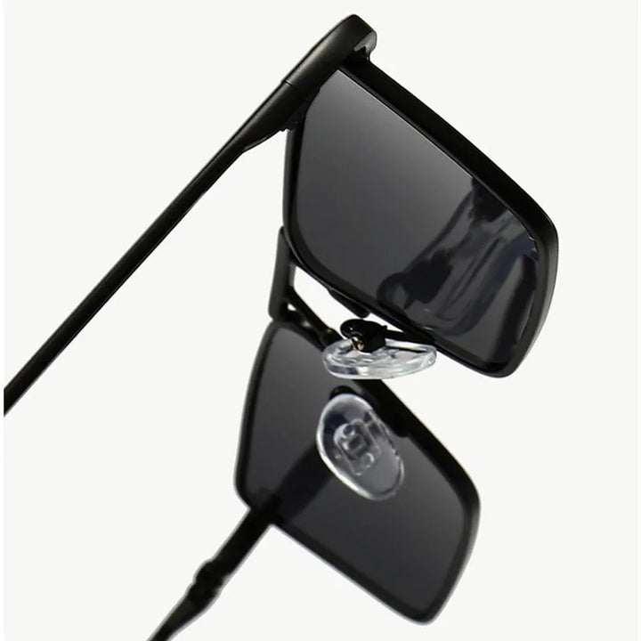A close-up view of Avalon Sunglasses with rectangular lenses and black frames, highlighting the nose pads and hinges against a plain white background.