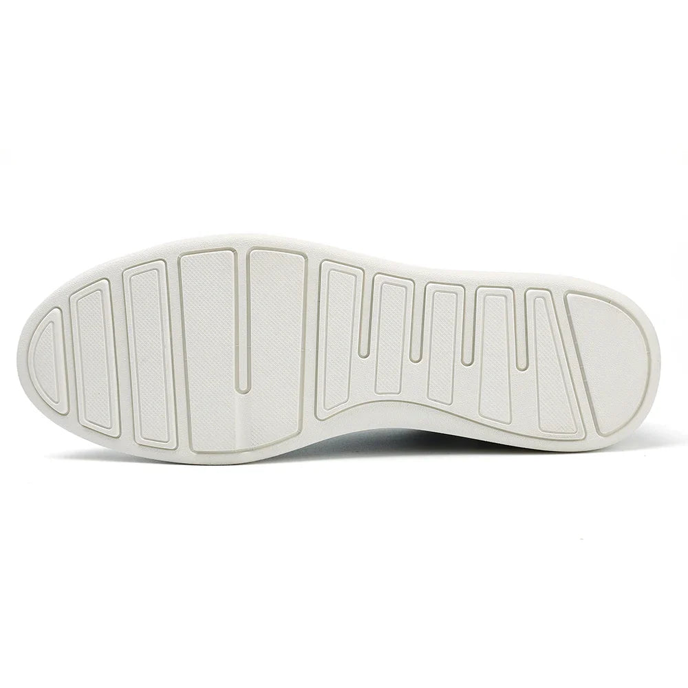 White rubber shoe sole with a textured pattern featuring wide, rectangular grooves and ridges arranged lengthwise for traction. Ideal for lightweight sneakers, the sole is clean, appears new, and ensures comfort with every step.