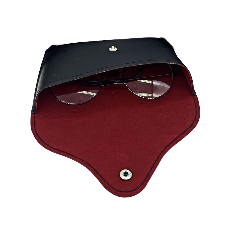 A pair of eyeglasses is partially visible inside an open, black and red vegan leather sunglasses case with a snap button closure, shown on a white background for a protective touch.
