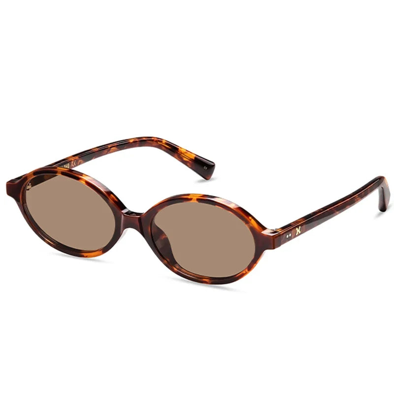 Brown tortoiseshell retro oval sunglasses with dark lenses, featuring a lightweight acetate frame. Angled view shows the arms and frame detail against a white background.