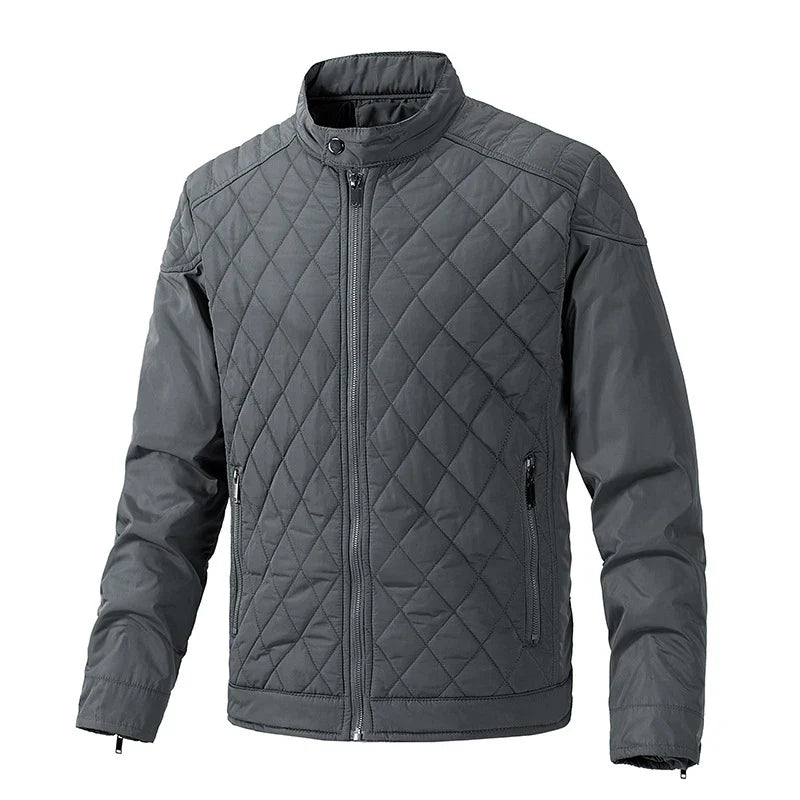 Gray quilted slim-fit jacket with a front zipper, stand-up collar, and two zippered side pockets. The diamond-patterned stitch design on the torso and upper sleeves pairs with wind-resistant fabric for extra comfort.