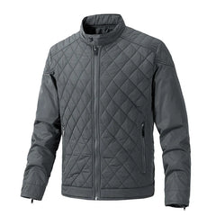 Gray quilted slim-fit jacket with a front zipper, stand-up collar, and two zippered side pockets. The diamond-patterned stitch design on the torso and upper sleeves pairs with wind-resistant fabric for extra comfort.
