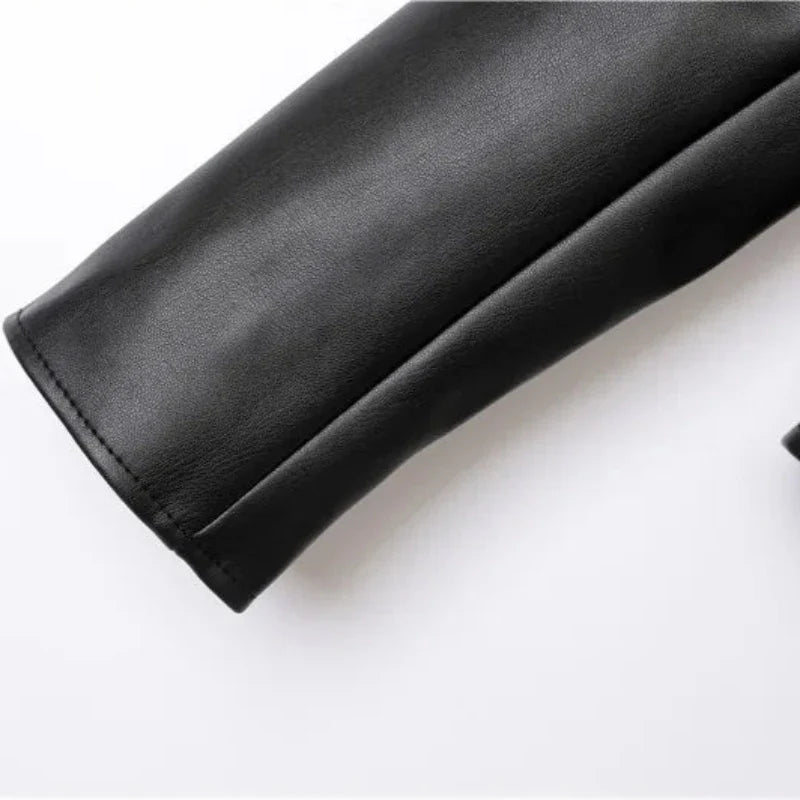 A close-up of a black leather sleeve with neat stitching and a sleek zipper pocket, shown against a plain white background.