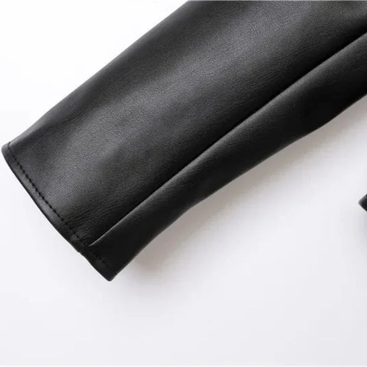 A close-up of a black leather sleeve with neat stitching and a sleek zipper pocket, shown against a plain white background.